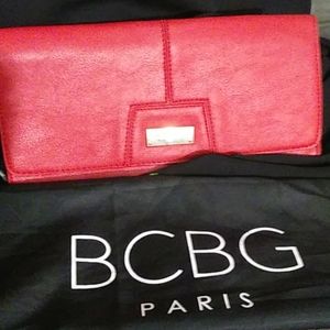 BCBG Paris leather-look red envelope clutch.
